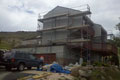 Stucco - Basecoat in process | Stone - Manufactured